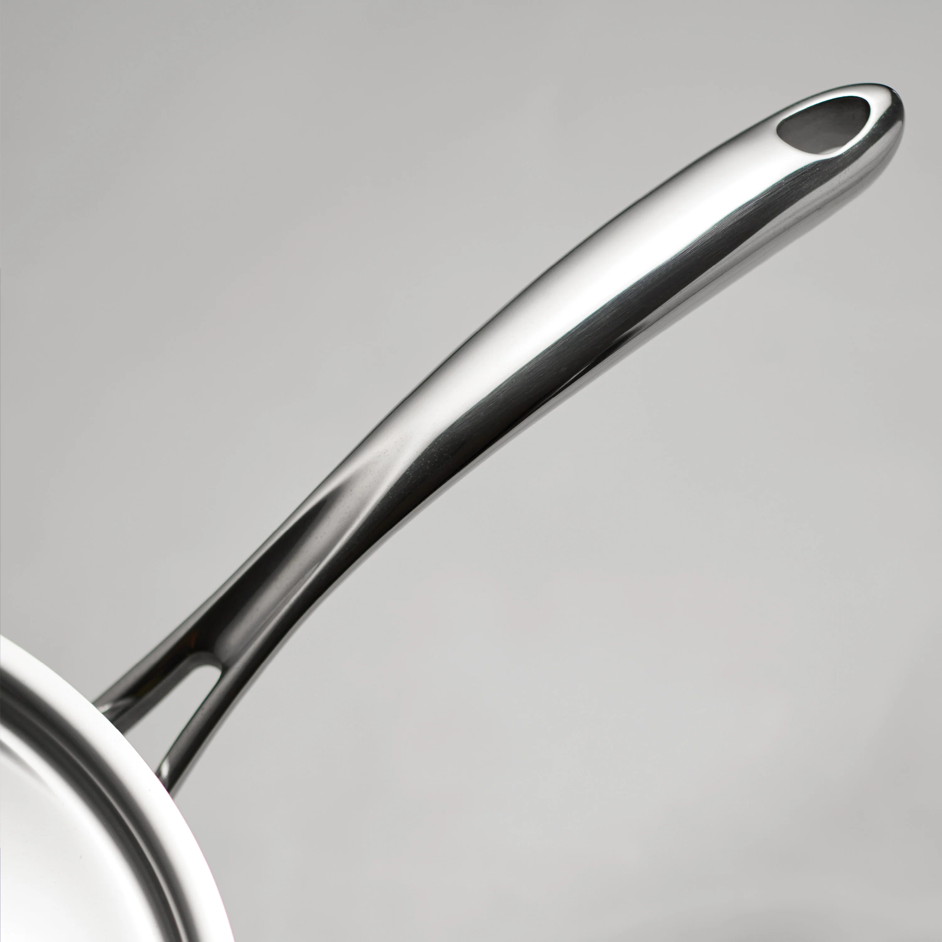 Utsava Tri-Ply Clad 2.2 Qt Covered Saucepan with Ceramic Interior - Image 7